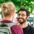 Two guys looking each other in the eye